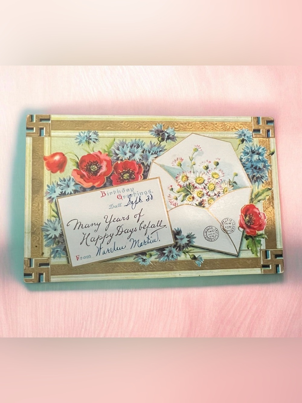 Vintage 1909 Vintage floral birthday postcard with swastika good luck symbols.